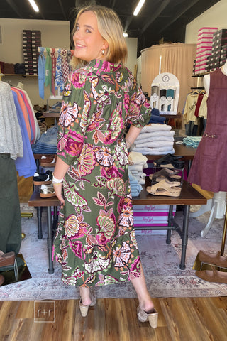 Angled view of the Umgee olive paisley tiered midi dress K0645 showing the midi length and flowy tiered skirt, worn with Corkys Knot Gonna Happen gold heeled mules.