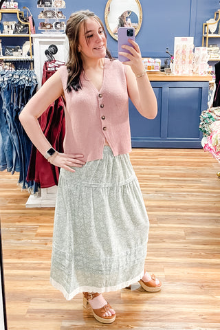 Wishlist outfit with blush sweater vest paired with sage and white floral midi skirt and Corkys Daddys Money tan chunky block heel sandals