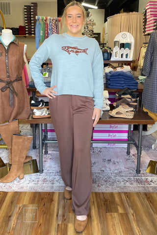 Full front view of Wishlist coastal fish graphic sweater styled with brown wide leg trousers - STY# WL26-14011