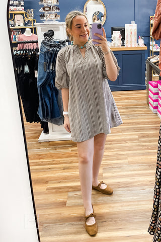 Front view of the Wishlist Latte Gingham Mini Dress, style WL2613777, shown in a mirror