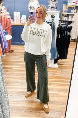 Wishlist Off White Mocha Floral Graphic Howdy Sweatshirt WL26-12822 paired with hunter green with micro polika dots corduroy wide leg pants mirror selfie