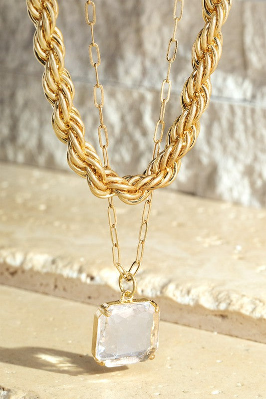 gold layered chain necklace with crystal pendant