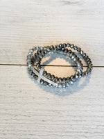 beautiful hematite and silver glass bead 3-strand bracelet with silver cross accent piece