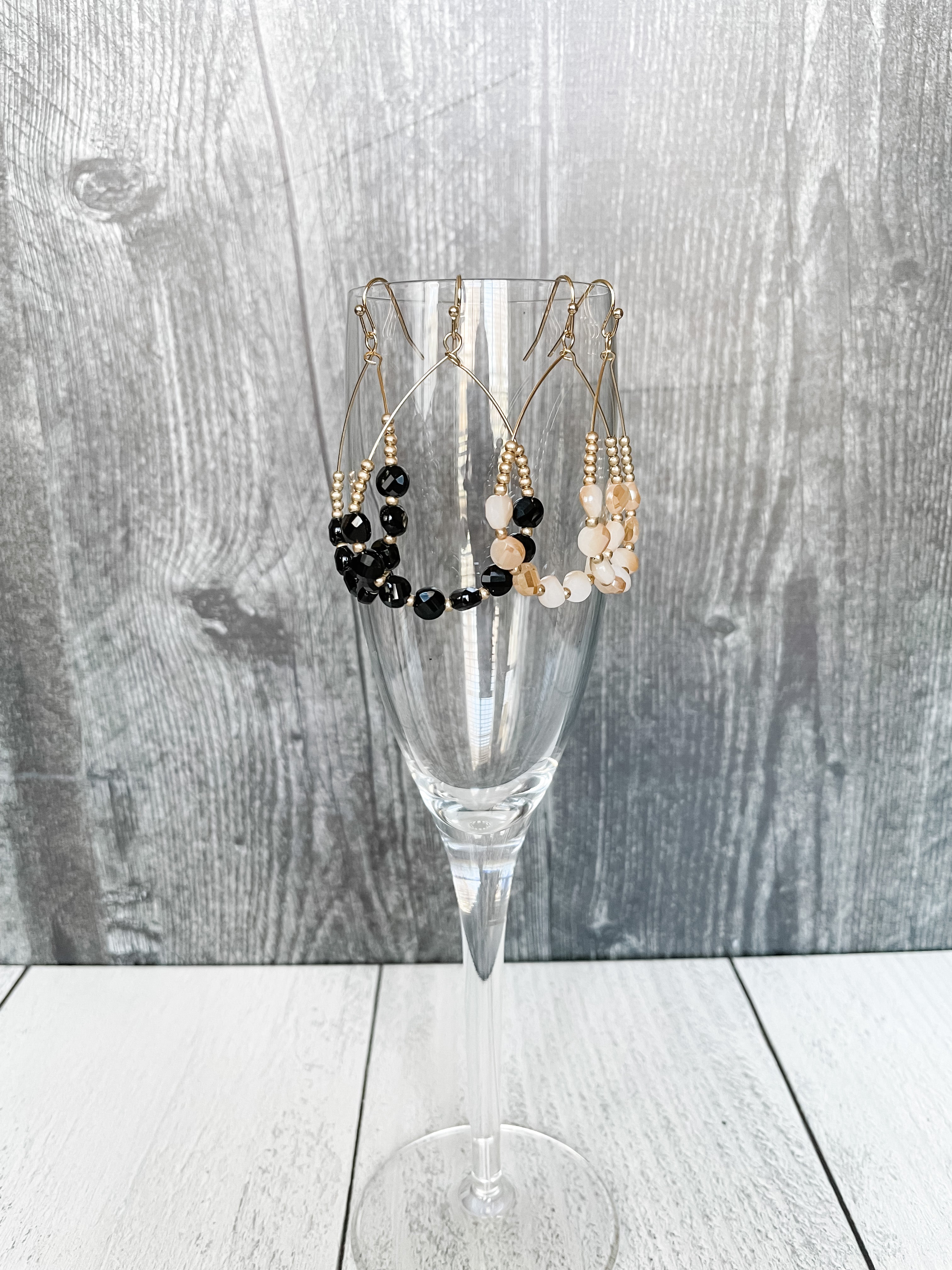 gold and black and gold and ivory teardrop earrings with glass beads